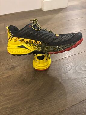 La Sportiva men’s Yellow and Black Sneakers size 10.